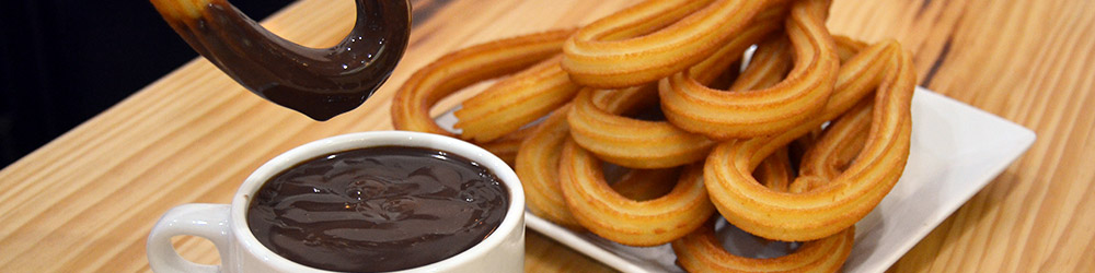 Chocolatadas con churros y porras para colegios en Madrid.